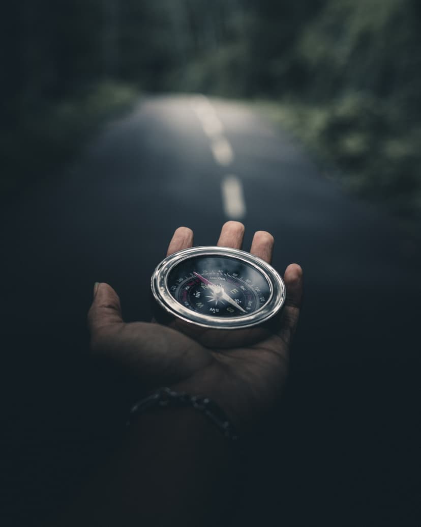 Finding Sales Leads and Company Information with Job Data A hand holding a compass symbolizes finding the right path.